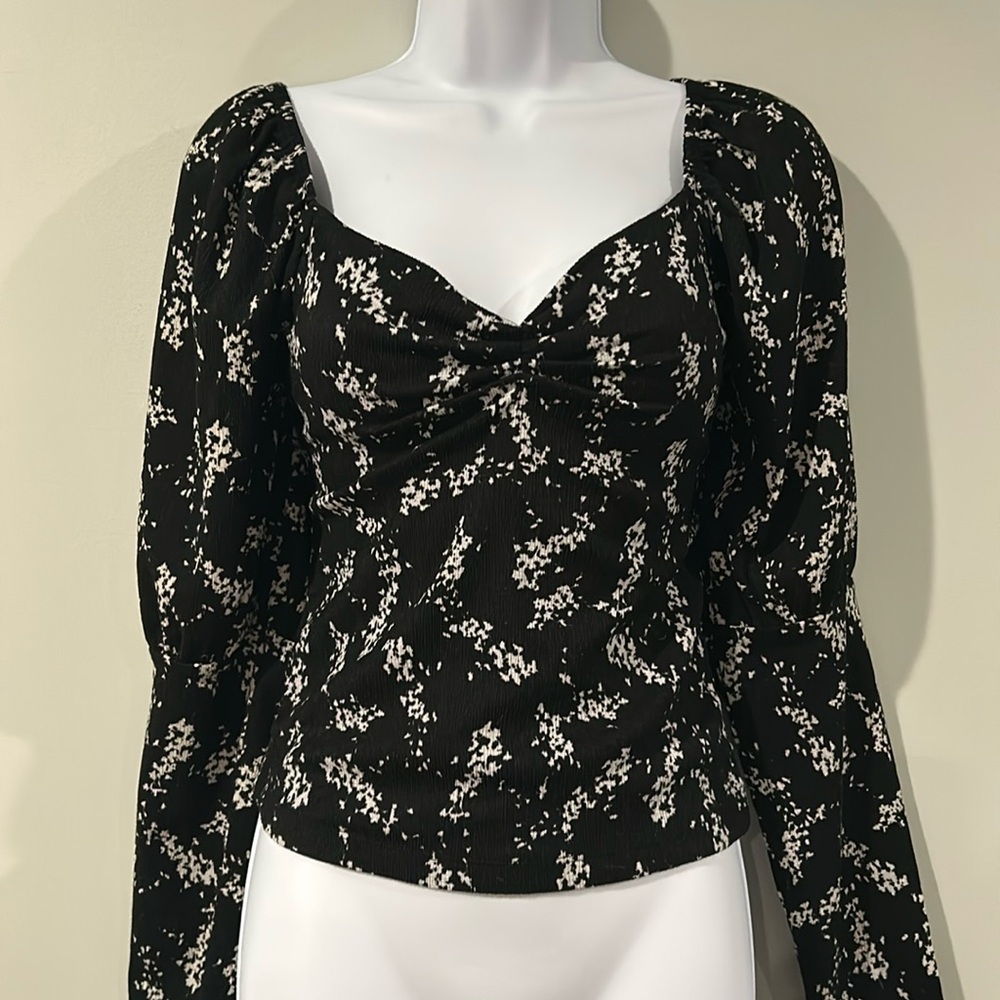 Black puff sleeve with bustier style long sleeved Anthropologie top size medium